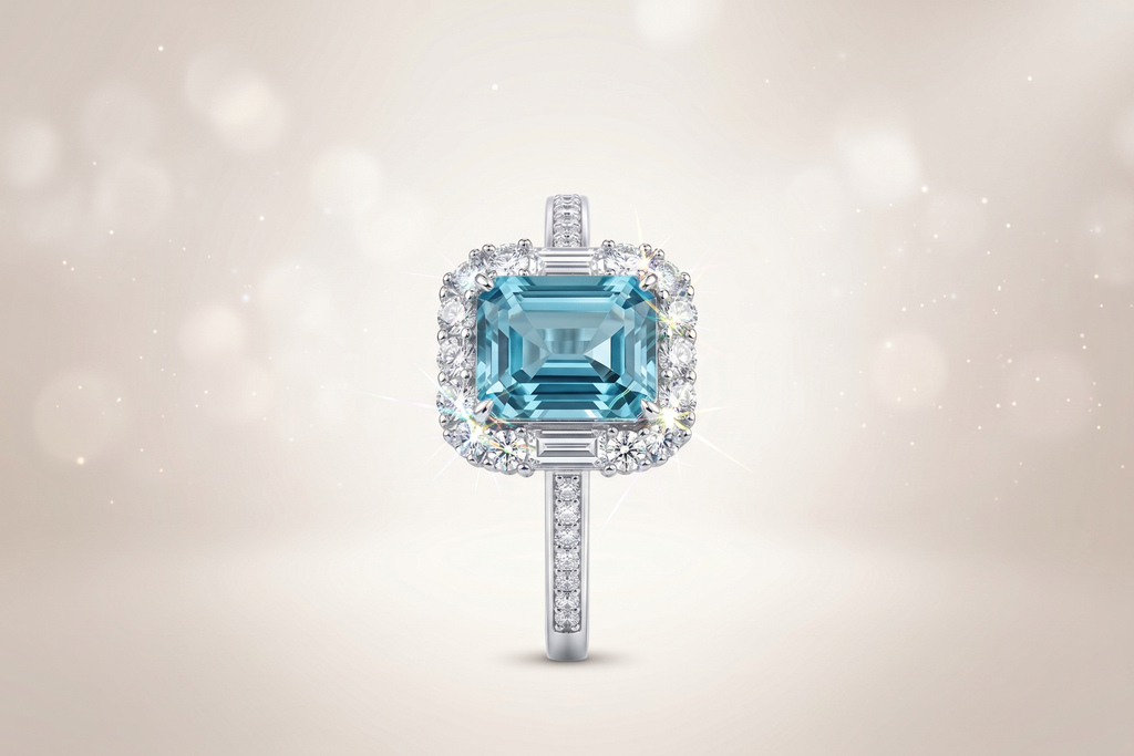 Bague ornée d'une pierre précieuse taille émeraude avec double halo et anneau pavé