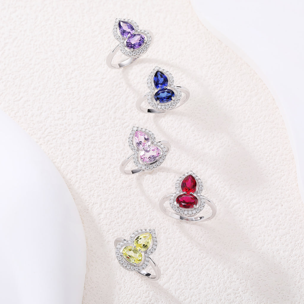 Bague sertie de pierres en forme de gourde avec halo complet