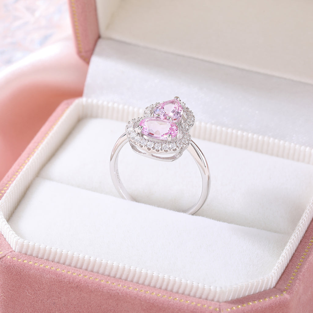 Bague sertie de pierres en forme de gourde avec halo complet