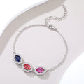 Three‑Stone Halo Oval Gemstone Silver Bracelet